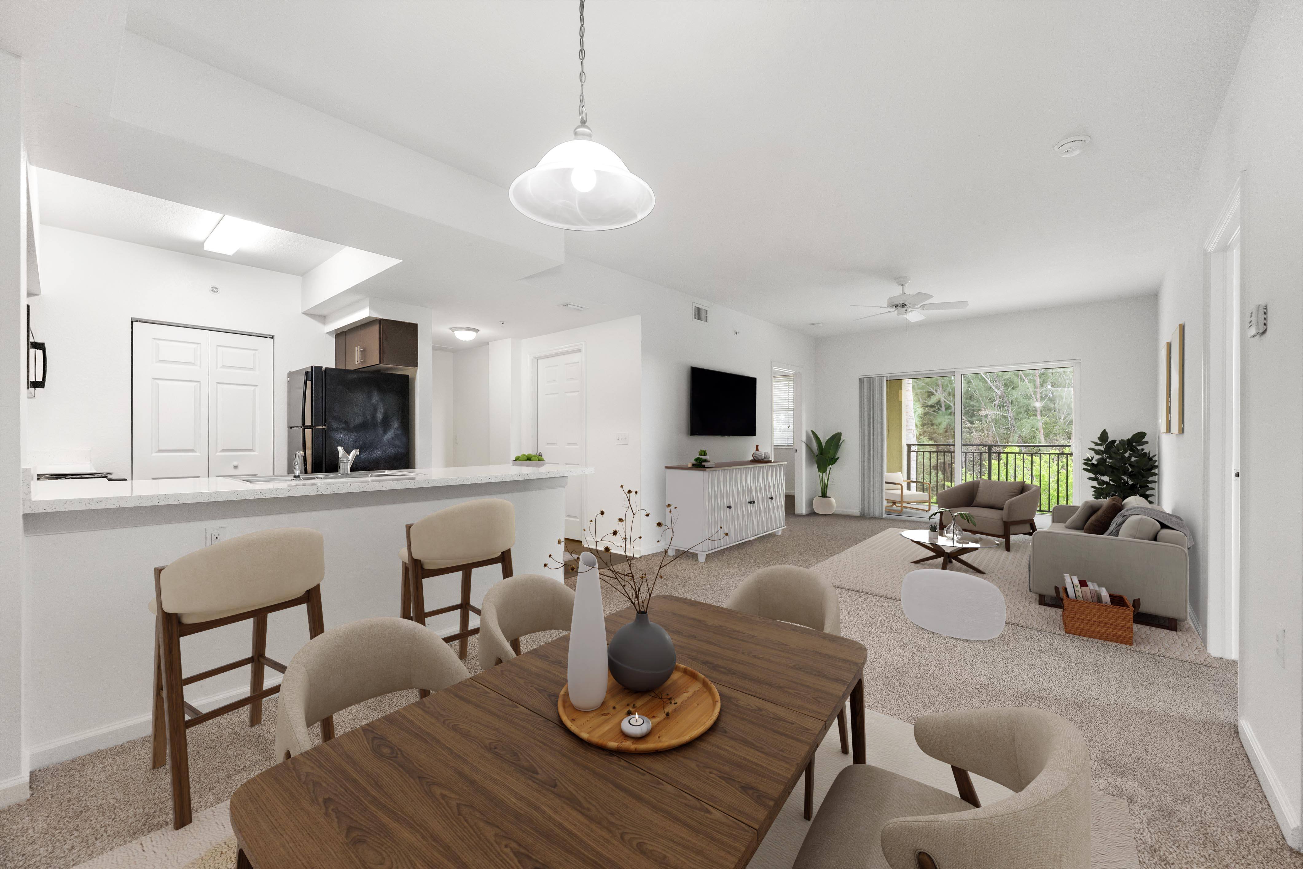 A modern living room with a wooden dining table and chairs.